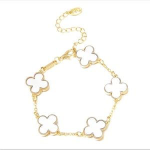 White four leaf clover gold tone bracelet